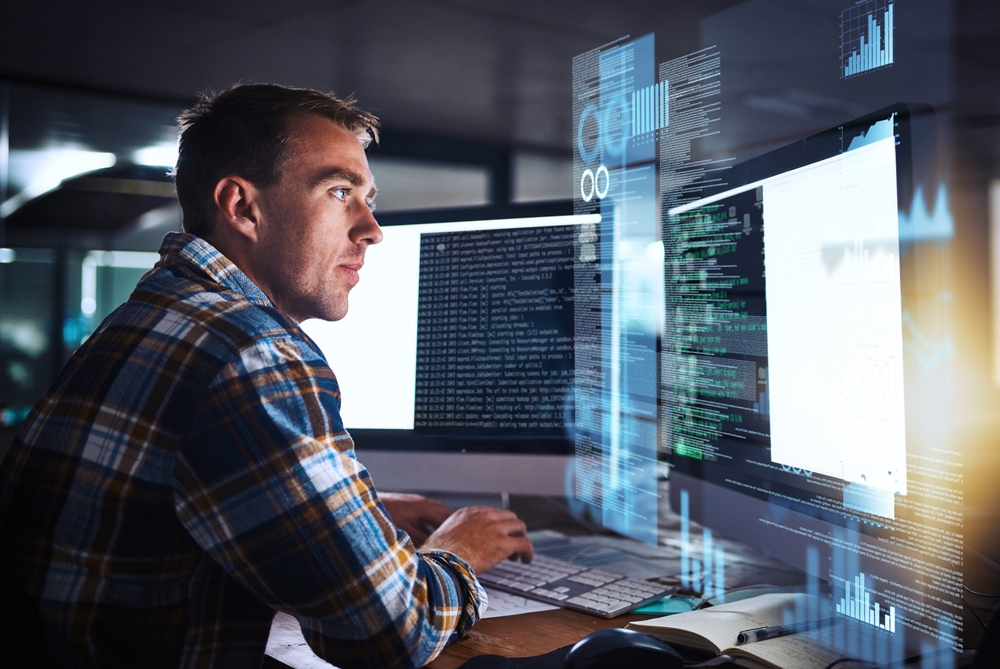 Worker looking at screens