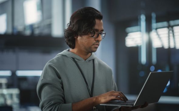 A man at a laptop